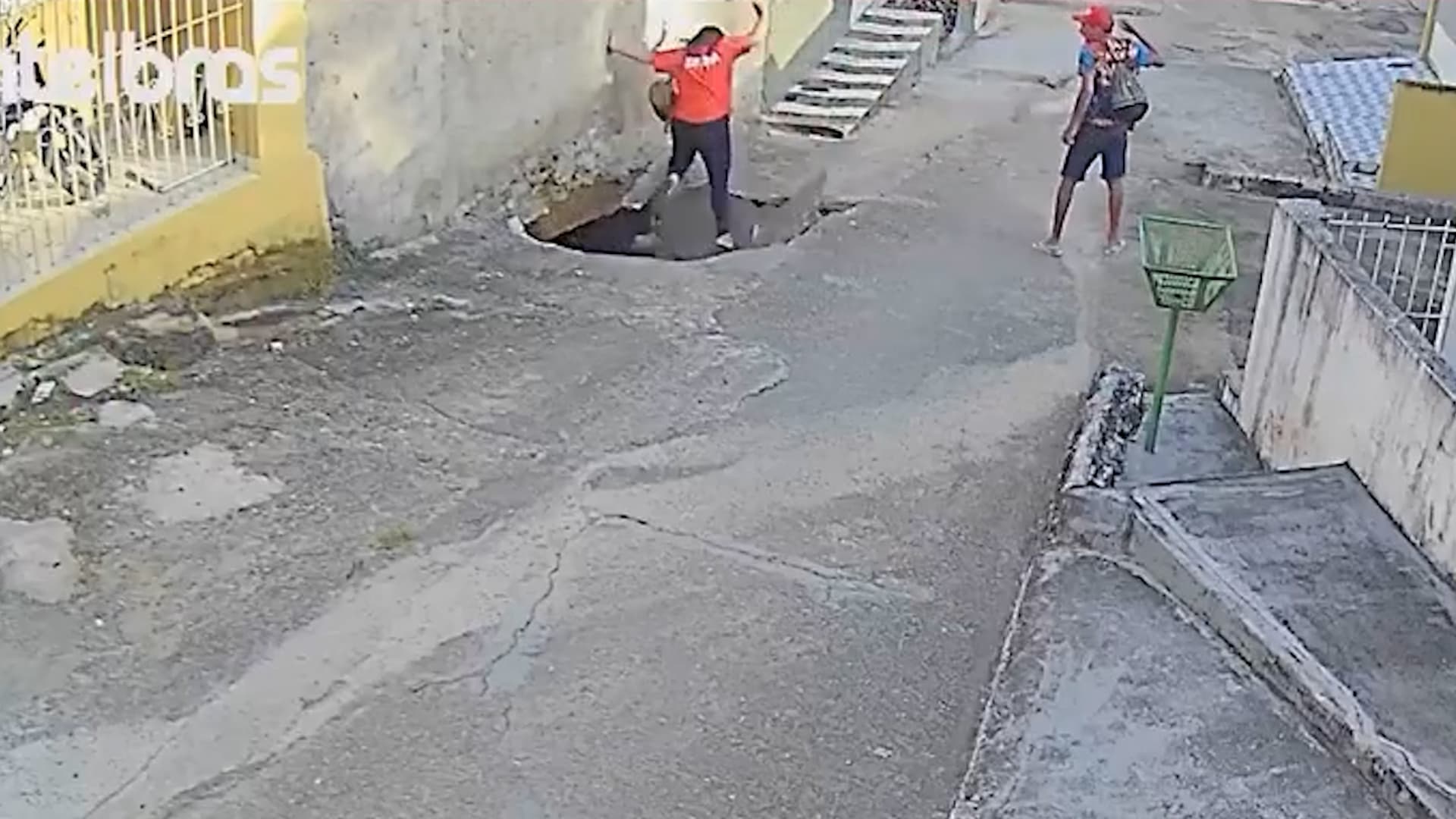 Woman Falls Into Crater As Street Collapses Beneath Her