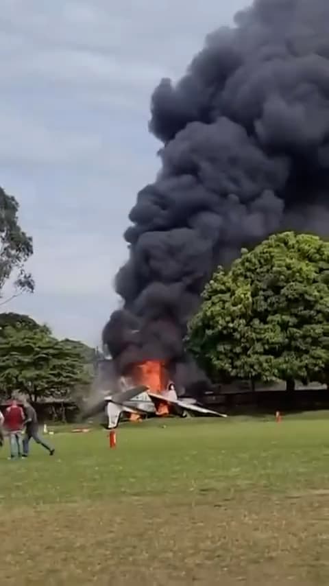Picture shows a small aircraft on fire after landing on a filed on Wednesday, June 10, 2026,  in Marilia, Brazil. Two pilots died in the crash and one was injured. Note: Photo is a screenshot from a video. (Newsflash/NX)