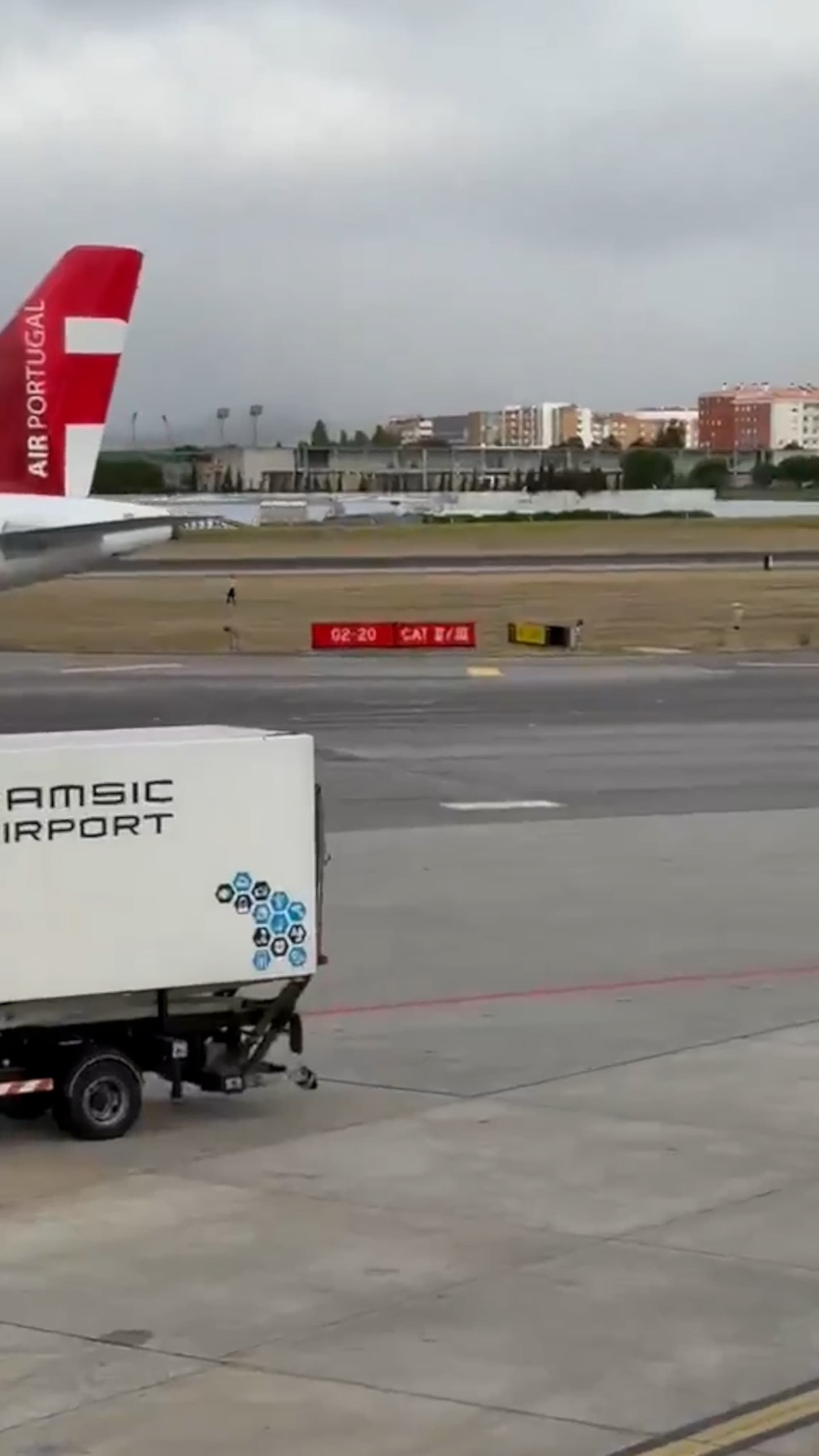 A man is arrested after jumping a fence and walking along a runway at Humberto Delgado Airport in Lisbon, Portugal. The suspect is a 36-year-old man of Portuguese nationality. Note: Photo is a screenshot from a video. (@tochanuno, Newsflash/NX)