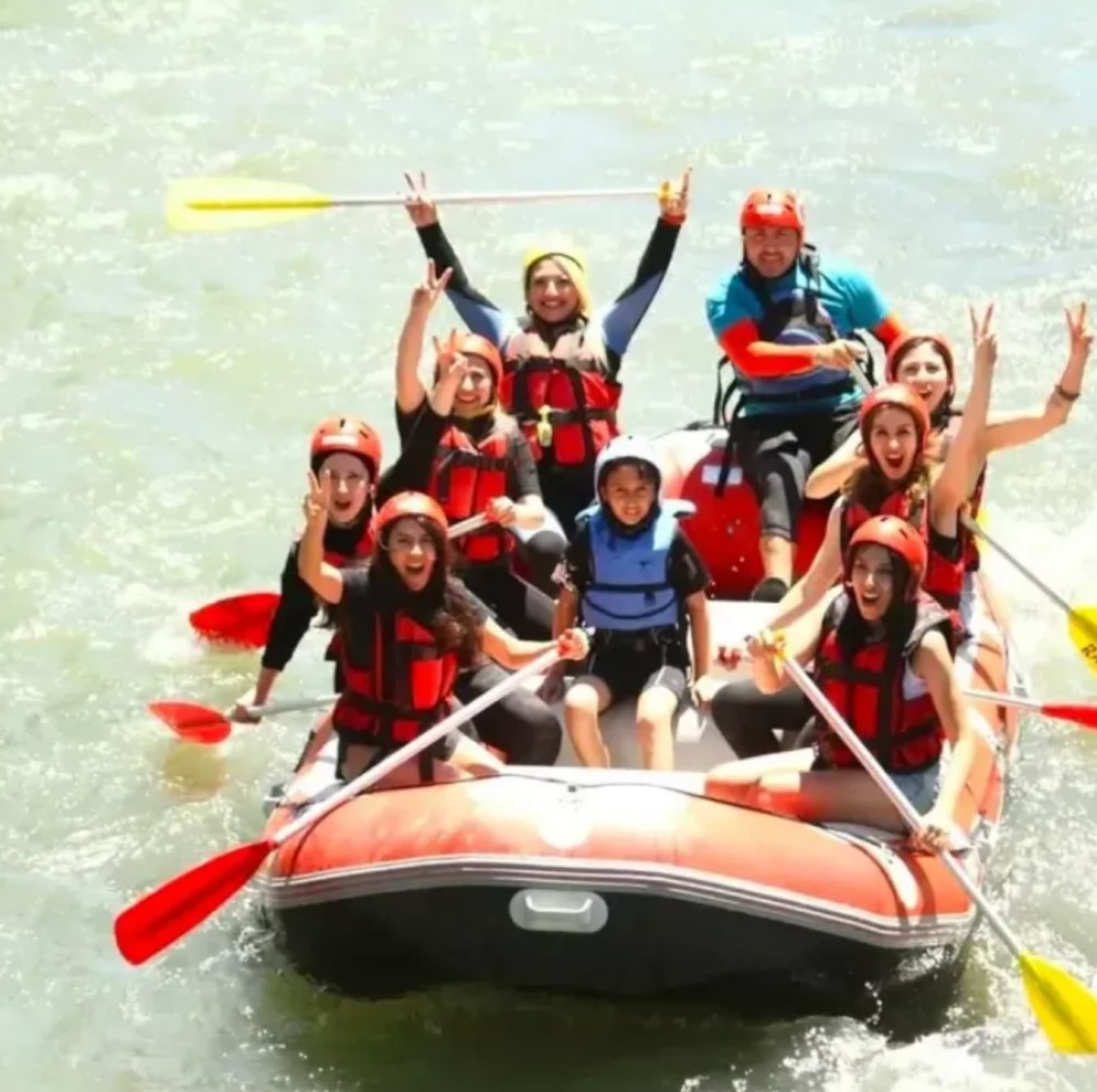 Cigdem Katalioglu poses with her son Taha Emir Kayaalp and other tourists rafting. He fell of the boat while rafting with his family and drowned after his leg became trapped by rocks. Note: Private picture. (Newsflash/NX)