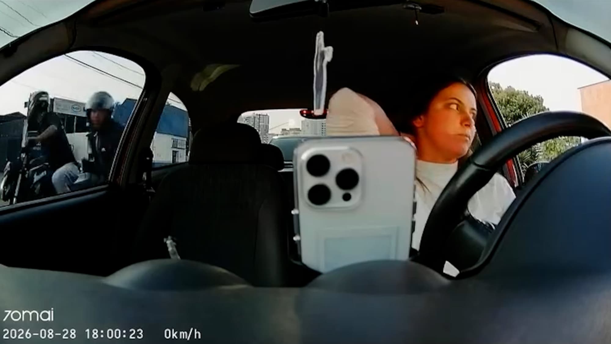 Brazil Woman Driver Bursts Into Tears After Biker Smashes Car Window And Snatches New Phone In Seconds