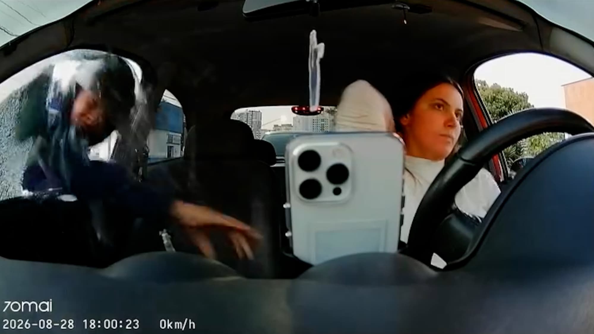 A ride share driver is robed driving in the middle of busy avenue, in Sao Paulo, Brazil. A recently purchased cell phone was stolen. Note: Photo is a screenshot from a video. (@talenkphotos, Newsflash/NX)