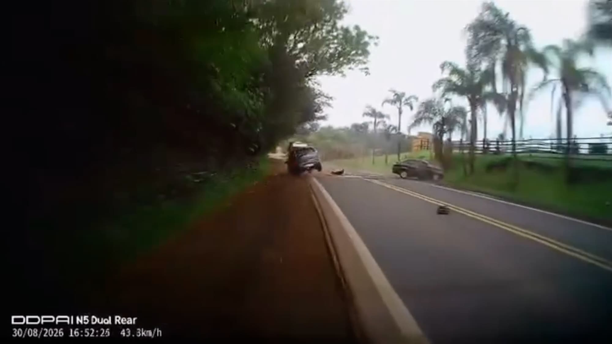 A car swerves into the oncoming lane and hits a car head-on in Boa Vista do Burica, Brazil. A 48-year-old driver died and two other people were injured. Note: Photo is a screenshot from a video. (Newsflash/NX)