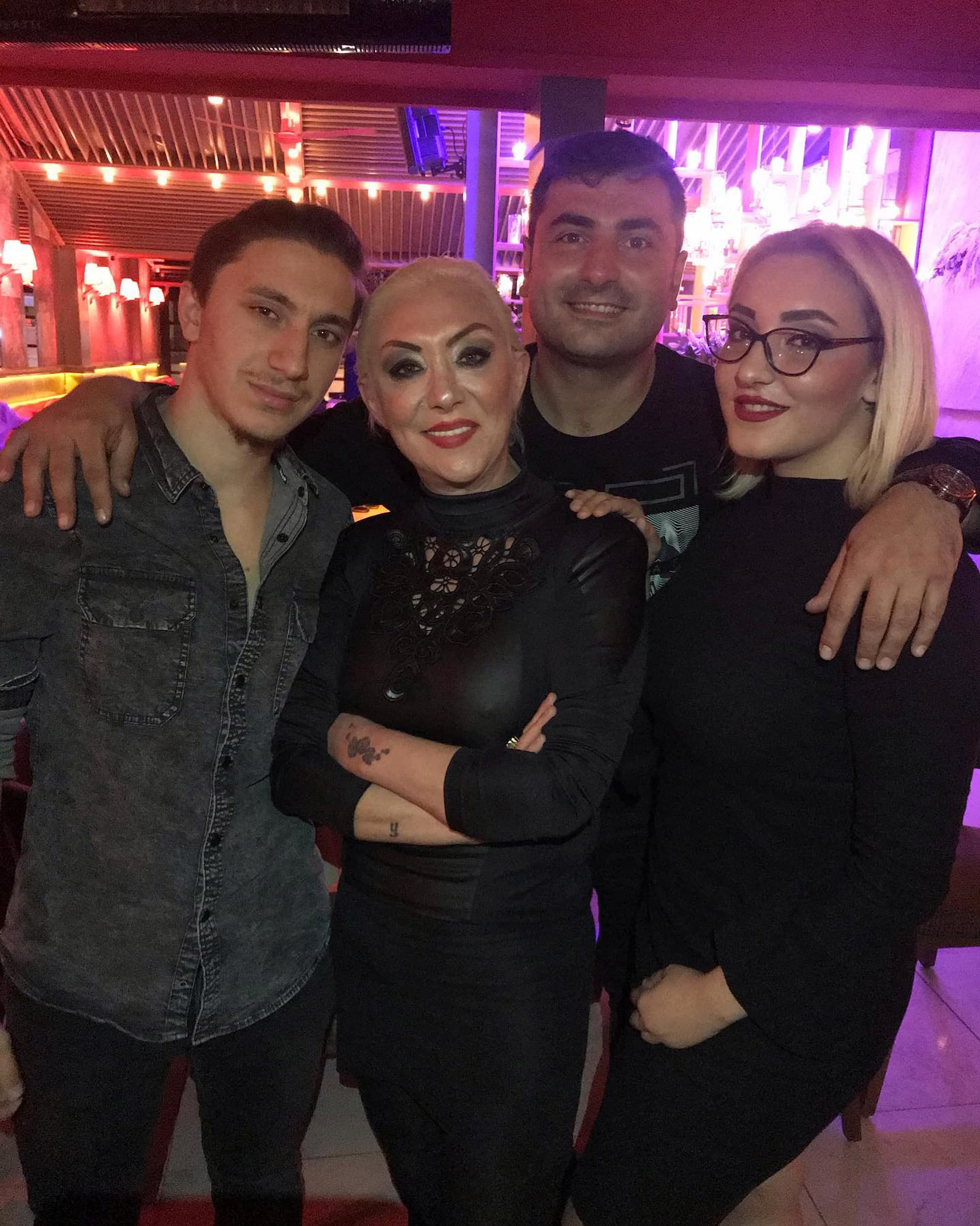 Singer Gul Tut, known as 'Gullu' poses with her son Tugberk Yagız (left), her daughter Tugyan Ulkem Gulter (right) and an unnamed man in undated photo. Her daughter was arrested in Istanbul, Turkey. Note: Private photo taken from social media. (Newsflash)