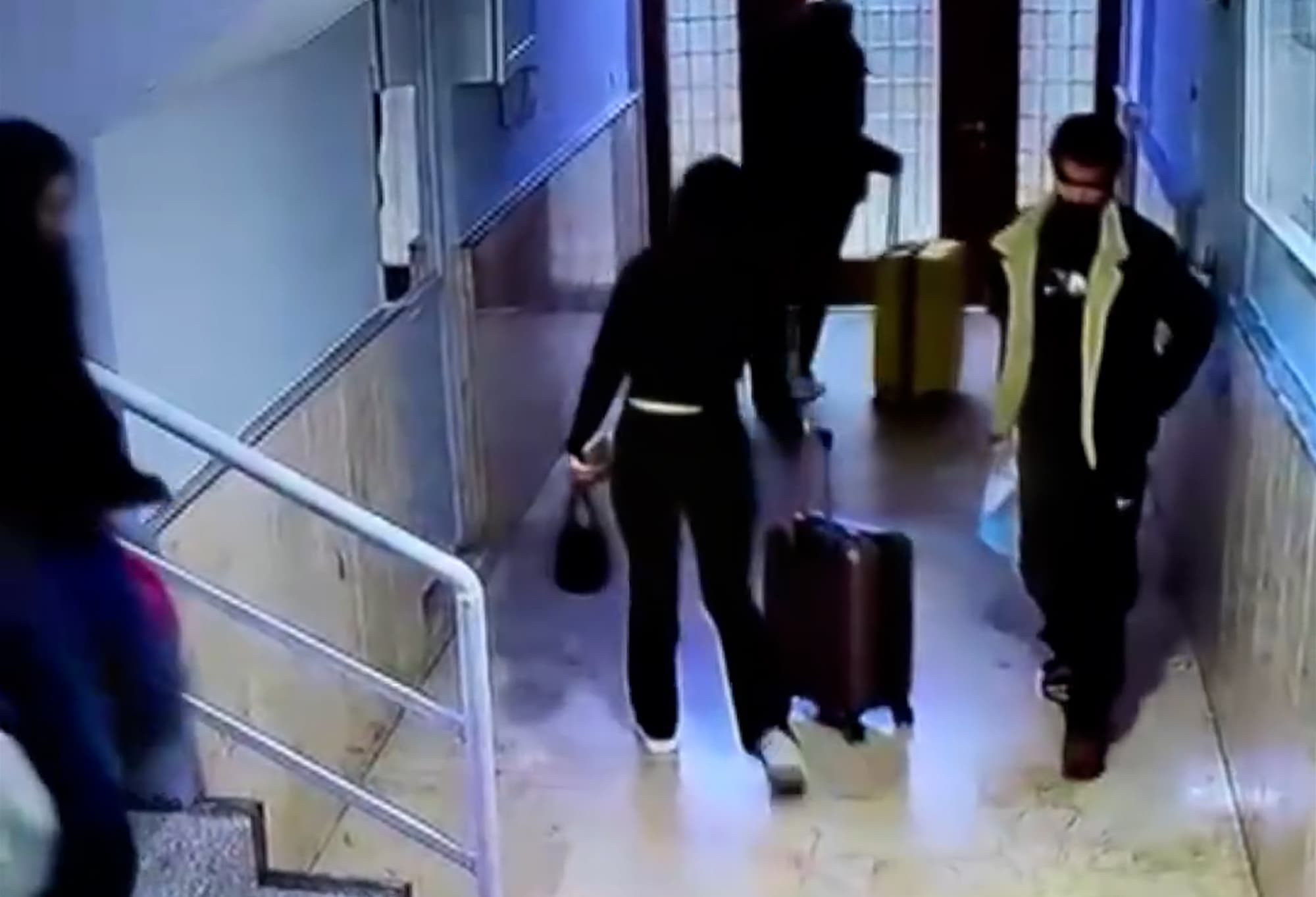 Picture shows Tugyan Ulkem Gulter and her friend Sultan Nur Ulu, leaving with suitcases. Photo is a screenshot from a video. (Newsflash)