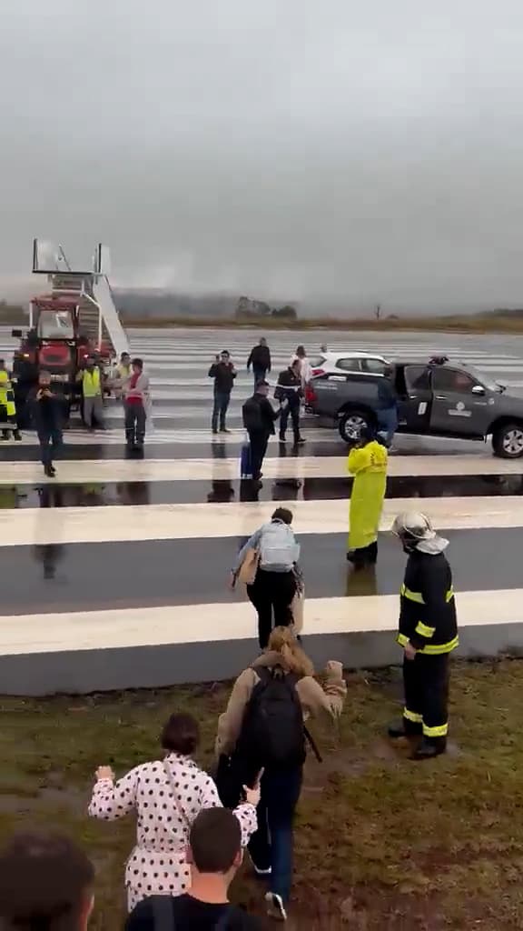 Passengers disembark a plane that veered off the runway during landing at Cascavel Regional Airport, Brazil. The plane was carrying 145 passengers and six crew members. Note: Photo is a screenshot from a video. (Newsflash/NX)