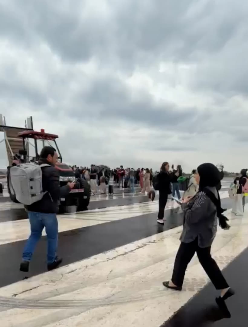 Passengers disembark a plane that veered off the runway during landing at Cascavel Regional Airport, Brazil. The plane was carrying 145 passengers and six crew members. Note: Photo is a screenshot from a video. (Newsflash/NX)
