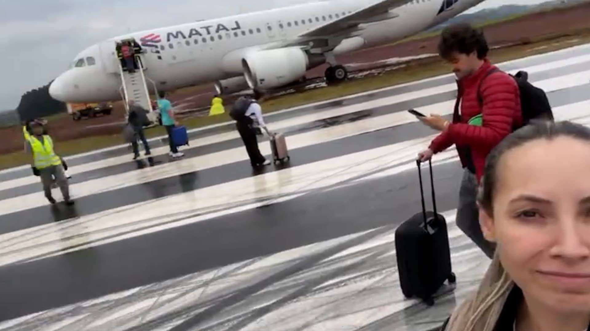 Passengers disembark a plane that veered off the runway during landing at Cascavel Regional Airport, Brazil. The plane was carrying 145 passengers and six crew members. Note: Photo is a screenshot from a video. (Newsflash/NX)