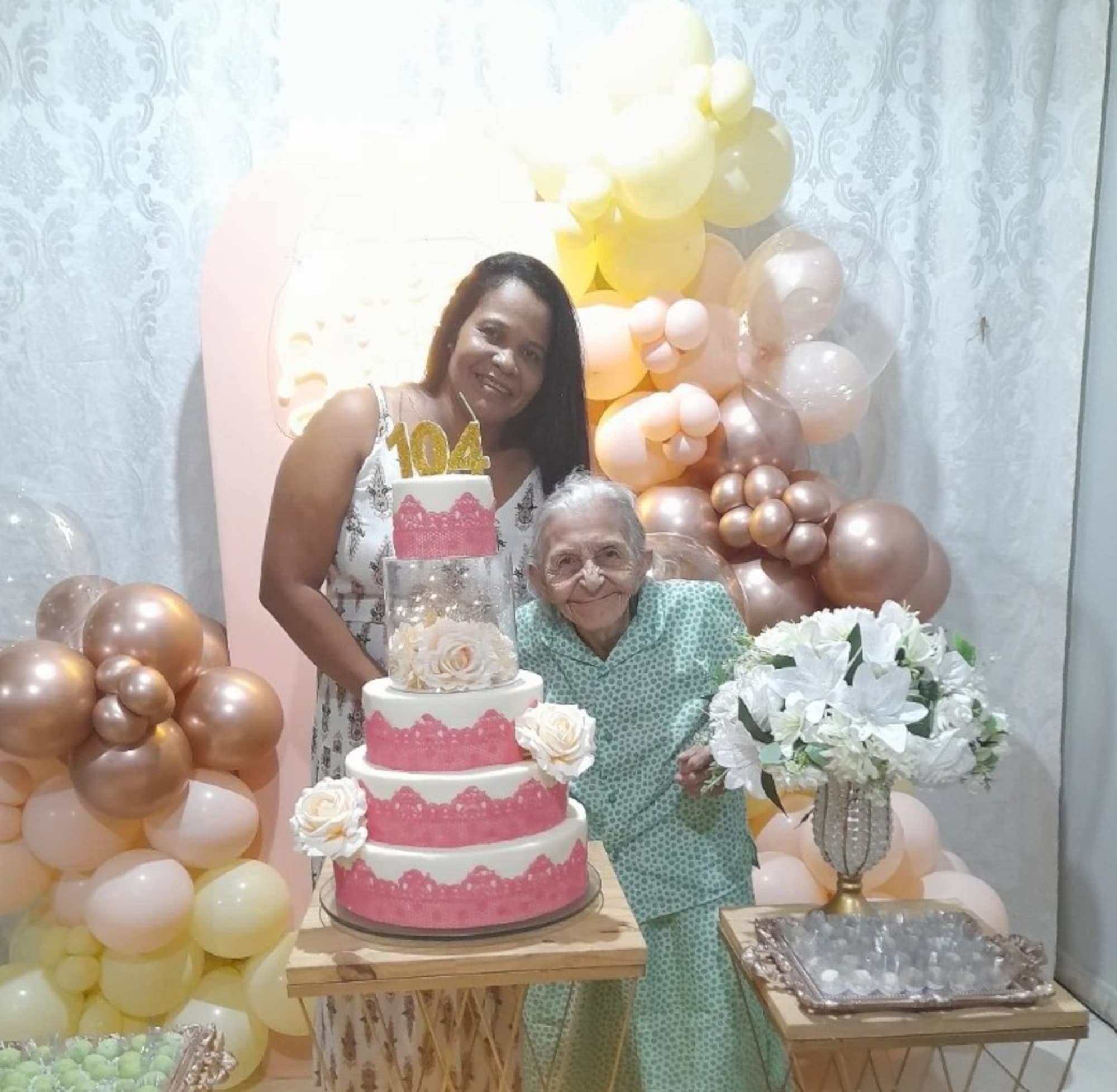 Maria Lurdes da Silva, 104, poses with birthday cake with an unidentified woman, undated.
A video of her dancing during her birthday vent viral on social media in Brazil.Note: Private picture. ( @josyramos0710, Newsflash/NX)